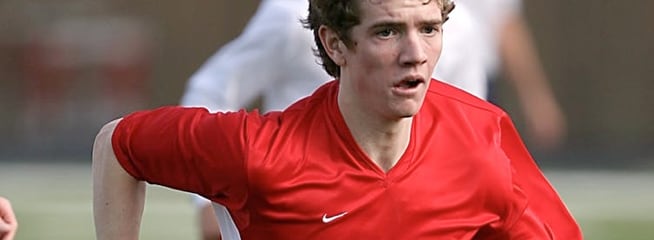 image of a soccer player in red jersey